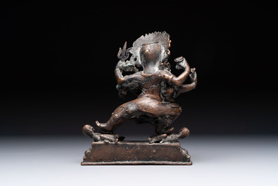 A Tibetan or Nepalese turquoise-inlaid partly-gilt bronze figure of White Tara and a figure of Makahala, 20th C.
