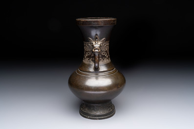 A Chinese archaistic bronze vase with 'mythical beast' handles, Yuan/Ming