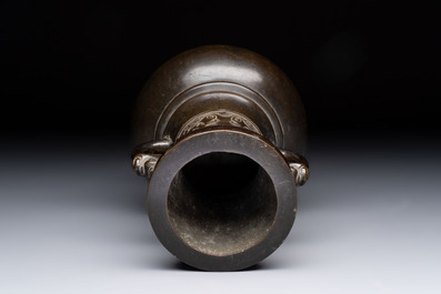 A Chinese archaistic bronze vase with 'mythical beast' handles, Yuan/Ming