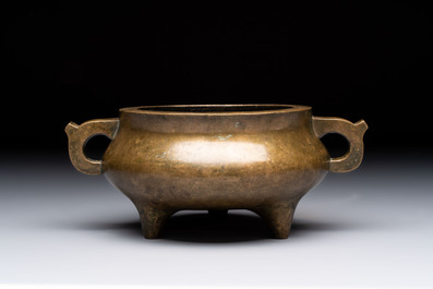 A Chinese bronze two-handled tripod censer, 19th C.