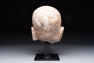 A Chinese sandstone head of a Luohan, Ming