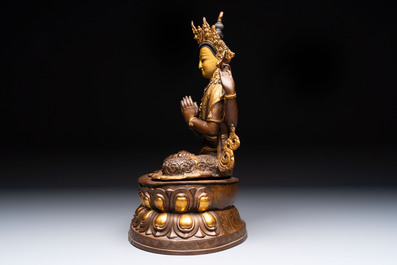 A Tibetan or Nepalese turquoise-inlaid partly-gilt bronze figure of White Tara and a figure of Makahala, 20th C.