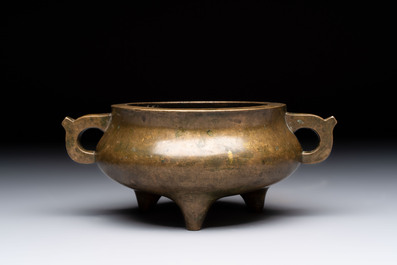 A Chinese bronze two-handled tripod censer, 19th C.