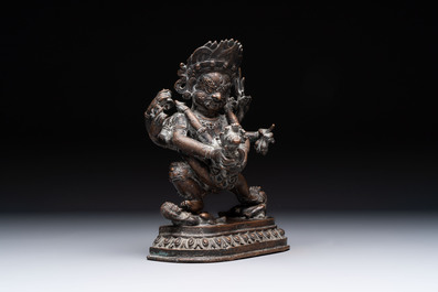 A Tibetan or Nepalese turquoise-inlaid partly-gilt bronze figure of White Tara and a figure of Makahala, 20th C.