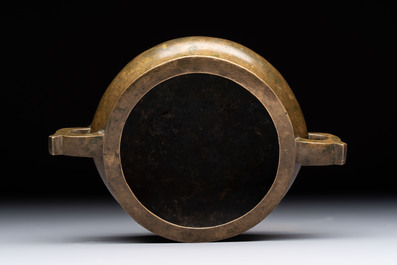A Chinese bronze two-handled tripod censer, 19th C.