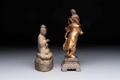 A Chinese bronze Taoist figure and a gilt-lacquered guardian, Ming