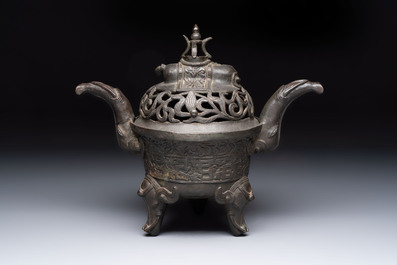 A Chinese bronze 'elephant' tripod censer and cover, Ming