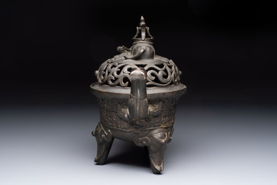 A Chinese bronze 'elephant' tripod censer and cover, Ming