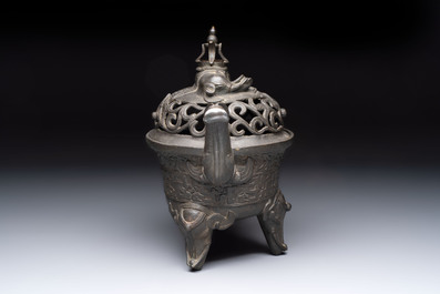 A Chinese bronze 'elephant' tripod censer and cover, Ming