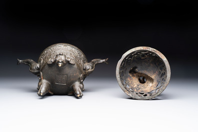A Chinese bronze 'elephant' tripod censer and cover, Ming