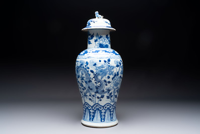 Two pairs of Chinese blue and white covered vases and a large covered vase, 19th C.