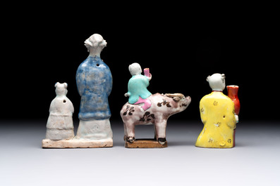 Nine Chinese blue, white, celadon-glazed and famille rose figures, 18/19th C.
