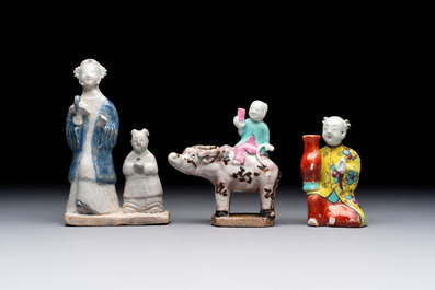 Nine Chinese blue, white, celadon-glazed and famille rose figures, 18/19th C.