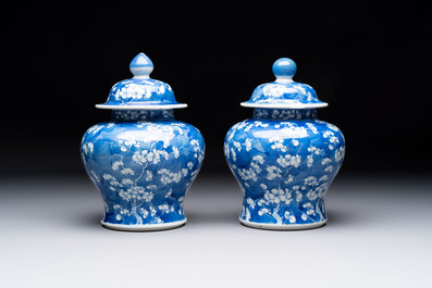 Two pairs of Chinese blue and white covered vases and a large covered vase, 19th C.