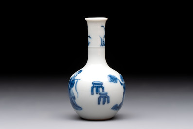 A fine Chinese blue and white miniature bottle vase with two ladies in a garden, jade 玉 mark, Kangxi