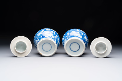 Two pairs of Chinese blue and white covered vases and a large covered vase, 19th C.