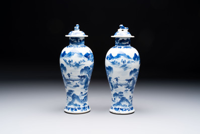 Two pairs of Chinese blue and white covered vases and a large covered vase, 19th C.