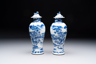 Two pairs of Chinese blue and white covered vases and a large covered vase, 19th C.