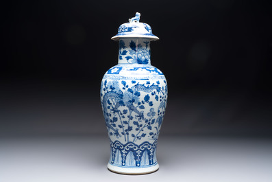 Two pairs of Chinese blue and white covered vases and a large covered vase, 19th C.