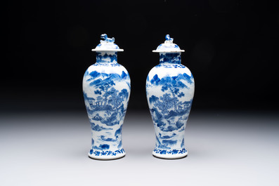 Two pairs of Chinese blue and white covered vases and a large covered vase, 19th C.