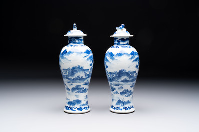 Two pairs of Chinese blue and white covered vases and a large covered vase, 19th C.