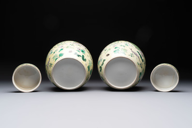 A pair of Chinese verte biscuit 'fish' jars and covers, 19th C.