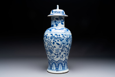 Two pairs of Chinese blue and white covered vases and a large covered vase, 19th C.