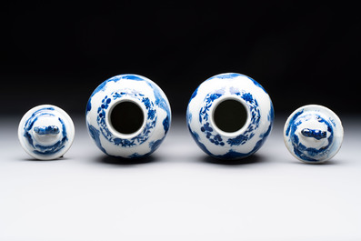 Two pairs of Chinese blue and white covered vases and a large covered vase, 19th C.