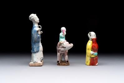 Nine Chinese blue, white, celadon-glazed and famille rose figures, 18/19th C.