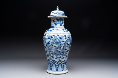 Two pairs of Chinese blue and white covered vases and a large covered vase, 19th C.