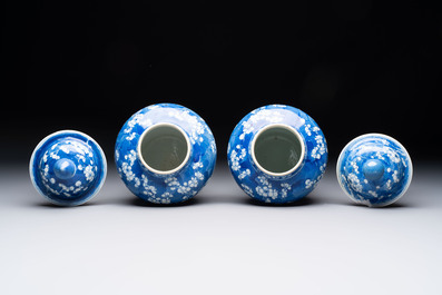 Two pairs of Chinese blue and white covered vases and a large covered vase, 19th C.