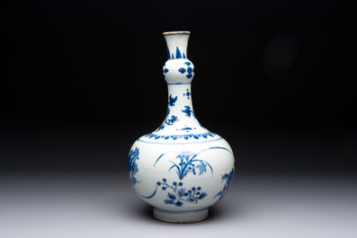 A Chinese blue and white bottle vase with floral design, Transitional period