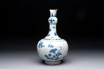 A Chinese blue and white bottle vase with floral design, Transitional period
