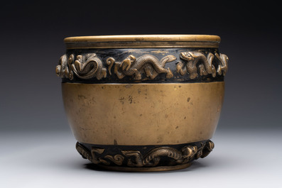 A Chinese bronze cylindrical censer with relief dragon design, Xuande mark, 18/19th C.