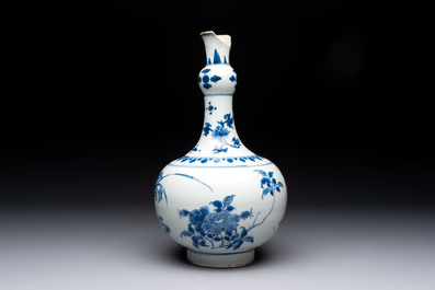 A Chinese blue and white bottle vase with floral design, Transitional period