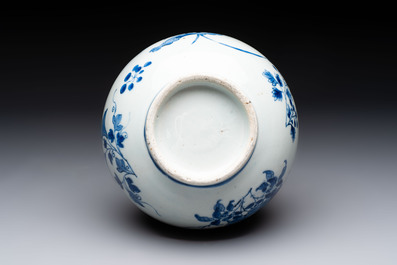 A Chinese blue and white bottle vase with floral design, Transitional period
