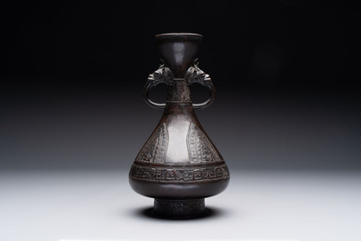 A Chinese archaistic bronze vase with dragon-form handles, Yuan/Ming