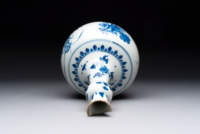 A Chinese blue and white bottle vase with floral design, Transitional period