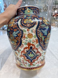 A Chinese English-decorated blue and white vase and cover, Kangxi