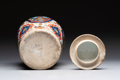 A Chinese English-decorated blue and white vase and cover, Kangxi