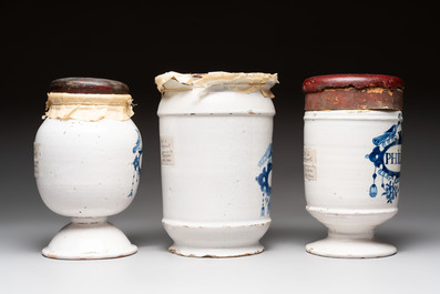 A varied collection of five blue and white faience pharmacy jars and a wet drug jar, Delft, Brussels and Lille, 18th C.