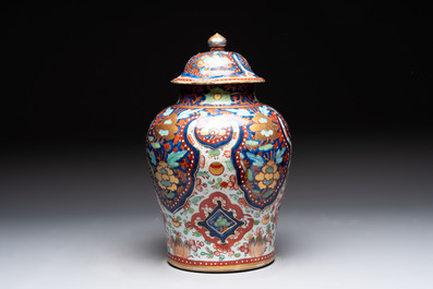A Chinese English-decorated blue and white vase and cover, Kangxi