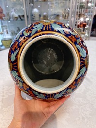 A Chinese English-decorated blue and white vase and cover, Kangxi