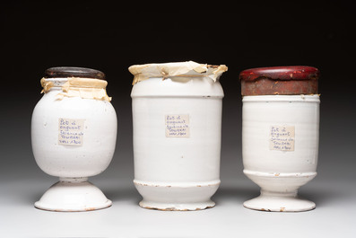 A varied collection of five blue and white faience pharmacy jars and a wet drug jar, Delft, Brussels and Lille, 18th C.