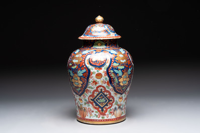 A Chinese English-decorated blue and white vase and cover, Kangxi
