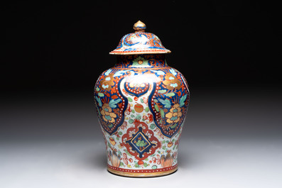 A Chinese English-decorated blue and white vase and cover, Kangxi