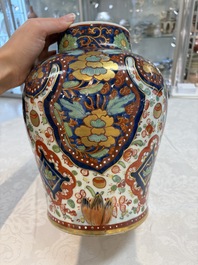 A Chinese English-decorated blue and white vase and cover, Kangxi