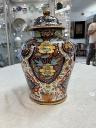 A Chinese English-decorated blue and white vase and cover, Kangxi
