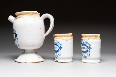 A varied collection of five blue and white faience pharmacy jars and a wet drug jar, Delft, Brussels and Lille, 18th C.
