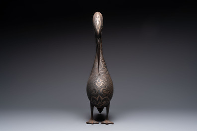 A large Qajar damascened steel bird-form sculpture, Persia, 19th C.